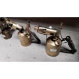 Two 20th C. brass and metal blow torches. {20 cm H}
