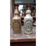 Two 19th C. ceramic ginger beer bottles - M P O'Brien Galteemore and Thwaites Dublin. {22 cm H}.