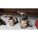 Two 20th C. brass and metal blow torches. {27 cm H} and {30 cm H}