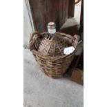 19th C. green glass wine bottle in original basket. {37 cm H x 26 cm Dia.}.