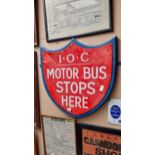 IOC Motor Bus Stops Here enamel and wooden sign in the form of Shield. {59 cm H x 57 cm W}