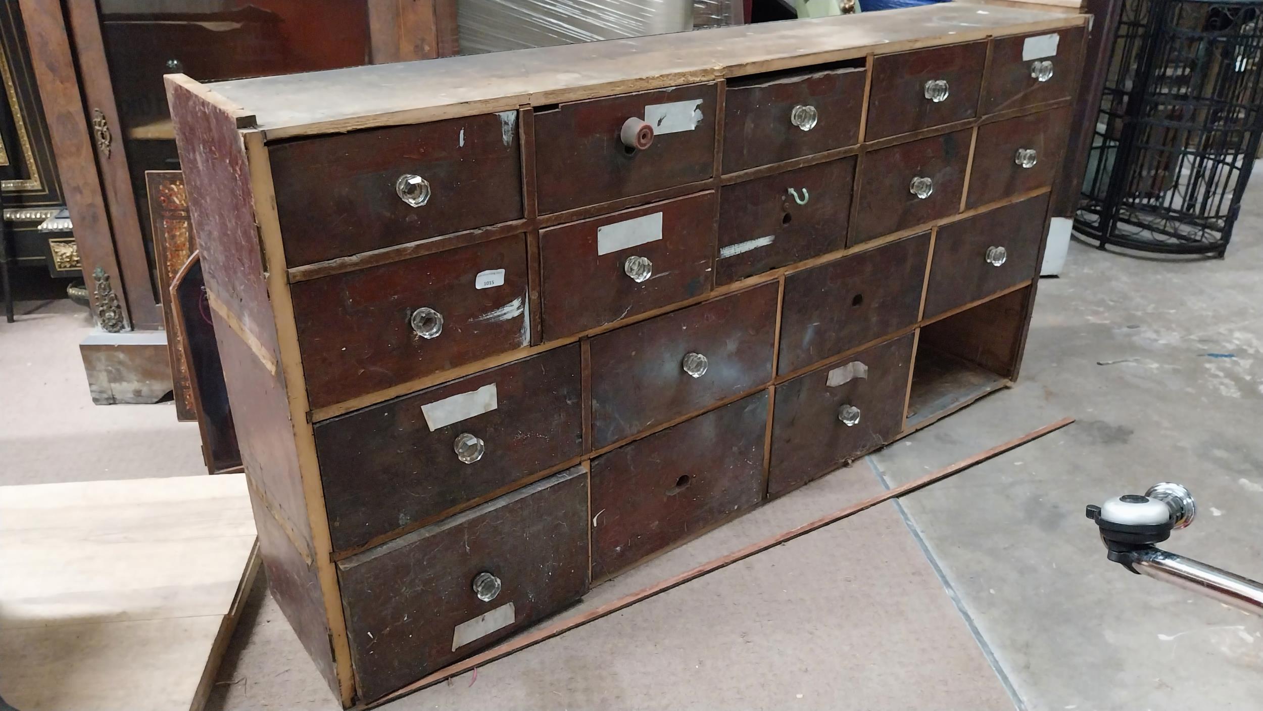Early 20th C mahogany bank of eighteen drawers. (missing one drawer). {76 cm H x 152 cm W x 29 cm