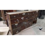 Early 20th C mahogany bank of eighteen drawers. (missing one drawer). {76 cm H x 152 cm W x 29 cm