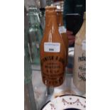 19th C. stoneware ginger beer bottle - E Smithwicks Mineral Water Kilkenny. {20 cm H x 7 cm Dia.}.