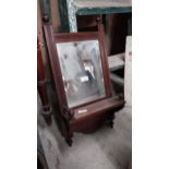 Edwardian mahogany wall mirror with brass rail. {62 cm H x 30 cm W x 13 cm D}.