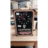 Guinness battery advertising clock. {32cm H X 22 cm W}.