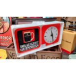 Perspex Draught Guinness advertising clock. {15 cm H x 30 cm W x 7 cm D}.