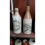 Two 19th C. stoneware ginger beer bottles. - P O'Kane Londonderry {20 cm H x 7 cm Dia.} and The