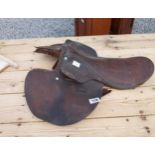 Leather saddle. {18 cm H x 63 cm W x 60 cm D}.