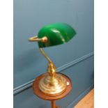 Brass banker lamp with green glass shade {38 cm H x 28 cm W x 14 cm D}.