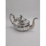 Irish Georgian silver teapot, of oval form decorated with finely bright cut engraving, with two