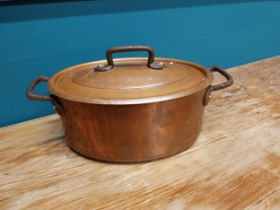 Good quality 20th C. copper lidded pot with wrought iron handles {14 cm H x 26 cm W x 15 cm D}.