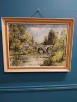 Framed oil on canvas Annalore Bridge and Cottage scene - Leo Toye 1974 {54 cm H x 70 cm W].