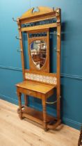 Good quality Edwardian oak and brass hall stand with tiled panel raised on turned legs and