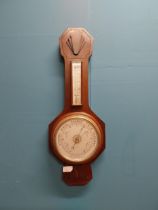 Art Deco mahogany barometer with silver dial. {63 cm H x 24 cm W}.