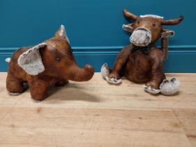 Two leather door stops in the form of Cow and Elephant {36 cm H x 38 cm W x 20 cm D and 27 cm H x 47