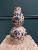 Chinese blue and white double-gourd vase bearing the Qianlong seal {36 cm H x 18 cm Dia.}.