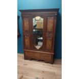 Edwardian carved walnut wardrobe with single mirrored door above long drawer raised on bracket