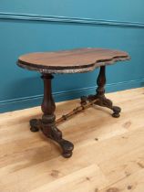 Victorian carved mahogany centre table with shaped top on turned legs on platform feet. {70 cm H x