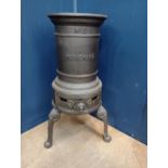 Cast iron three legged stove {H 58cm x W 34cm x D 34cm}.