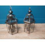 Pair of glass and metal hanging lanterns. {66 cm H x 23cm Diam}.