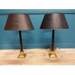 Pair of good quality brass and ebonised table lamps with cloth shades {95 cm H x 55 cm Dia.}.