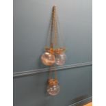 Set of three Ecclesiastical gilded metal and glass hanging lanterns {74 cm Drop x 18 cm Dia.}.