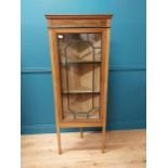 Edwardian mahogany and satinwood inlaid corner cabinet with astra glazed door raised on square