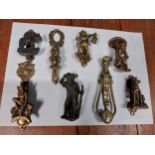 Selection of small brass door knockers. {14 cm H x 4 cm W} to {7 cm H x 4 cm W}.