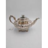 Fine quality Irish silver teapot, of circular bombe form decorated with repoussé work in the form of