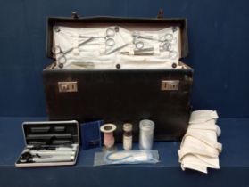 Surgeons bag with instruments {H 27cm x W 46cm x D 14cm }.