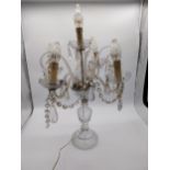 20th C. Moulded glass four branch table candelabra with some damage. {68 cm H x 42 cm Dia.}