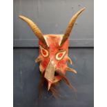 Hand carved wooden mask with horns and beard {H 43cm x W 26cm x D 20 cm}.