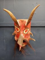 Hand carved wooden mask with horns and beard {H 43cm x W 26cm x D 20 cm}.