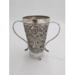 Indian silver beaker, chased in high relief with floral scroll work and a pair of Sinhalese double-