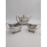 Irish Georgian silver three piece tea service with tapering rectangular body with chased floral