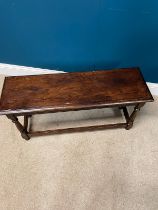 Edwardian carved oak window stool on turned legs and double stretcher {46cm H x 93cm W x 30cm D}