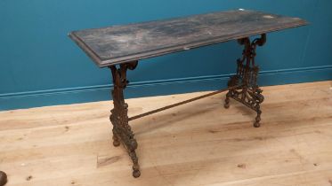 19th C. decorative cast iron table with ebonised top {73 cm H x 121 cm W x 54 cm D}.