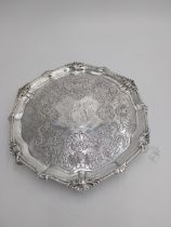 Irish silver salver, the rim decorated with an applied scroll border, the surface decorated with