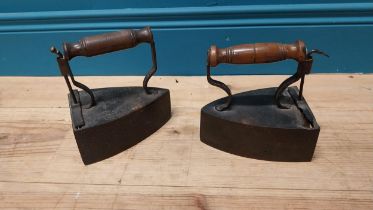 Pair of early 20th C. irons with turned wooden handles {17 cm H x 17 cm W x 11 cm D}.