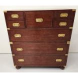Exceptional quality walnut chest of drawers with brass mounts and handles in the campaign style {105