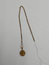 1922 Gold Swiss 10 francs piece set in a 14 carat gold pendant setting with chain. Obverse: On the