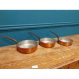 Set of three good quality early 20th C. French Demuynck copper saucepans {14 cm H x 38 cm W x 20