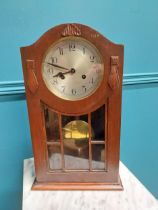 Art Deco stained pine mantle clock with silvered dial {46 cm H x 26 cm W x 15 cm D}.