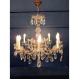 Eight branch brass and crystal chandelier {H 90cm x Dia 70cm}.