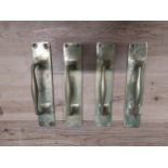 Set of four brass door handles {30 cm H x 7 cm W}.