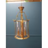 Brass and glass hall lantern. {100 cm H x 25 cm Dia.}.