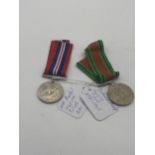 World War II Defence Medal and War Medal with ribbons.