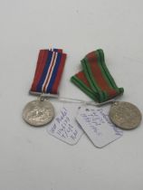 World War II Defence Medal and War Medal with ribbons.