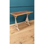 19th C. decorative cast iron table with mahogany top {75 cm H x 96 cm W x 50 cm D}.